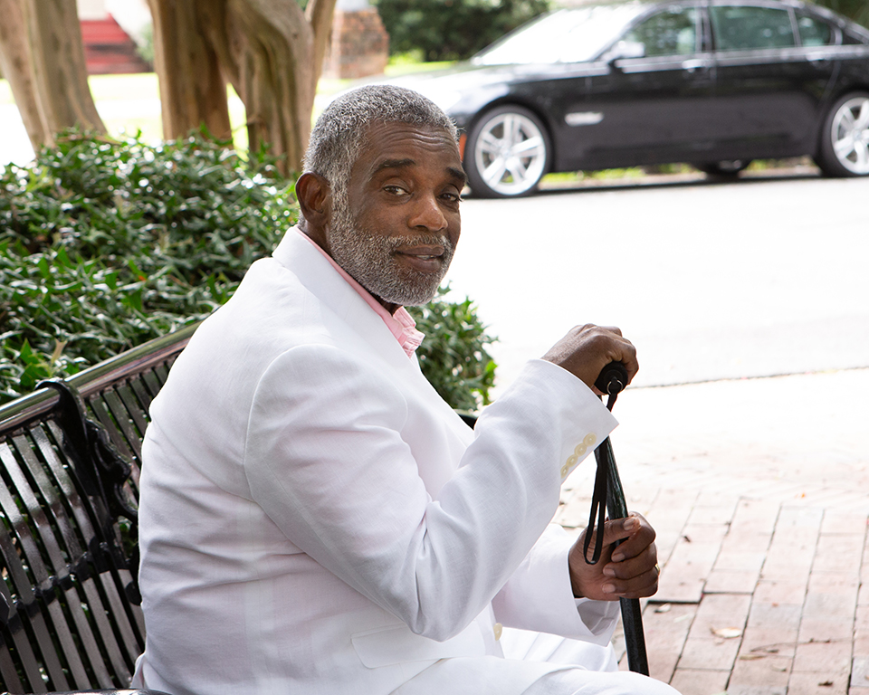grandfather portrait, man sitting in park, man with cane, man in white suit, picture of columbus ga man